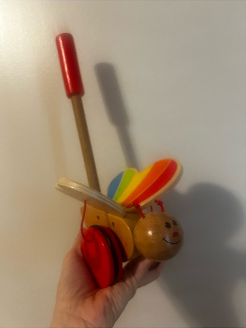 Rainbow Butterfly Push Toy with Red Handle